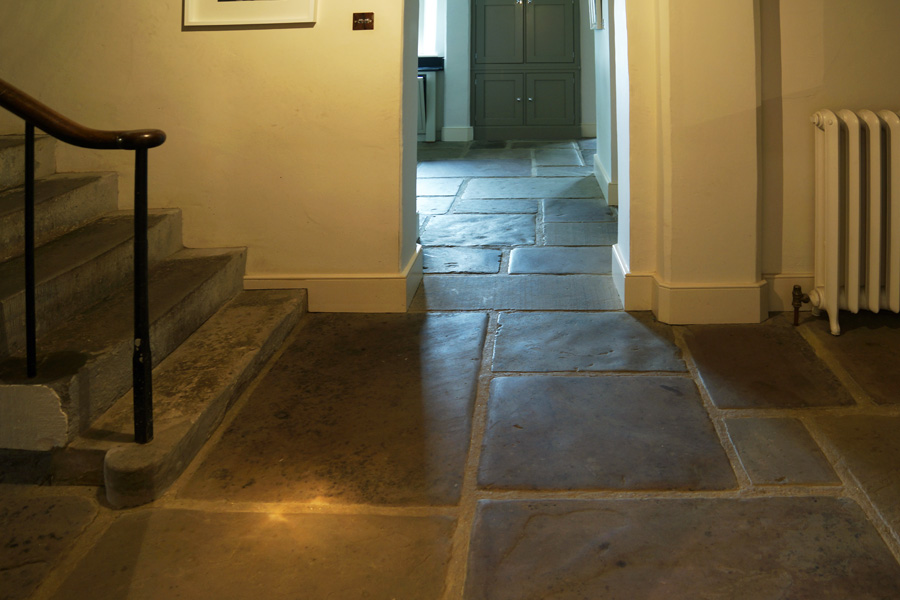 <span>Stone Floors</span><i>→</i>